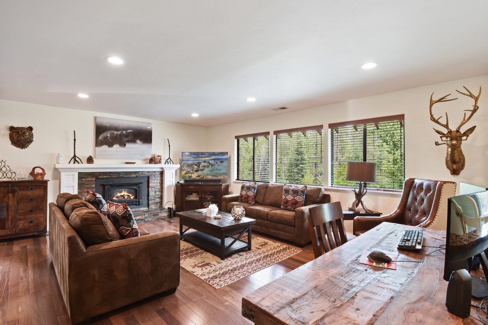 Living room with Smart TV, gas fireplace, and deck access