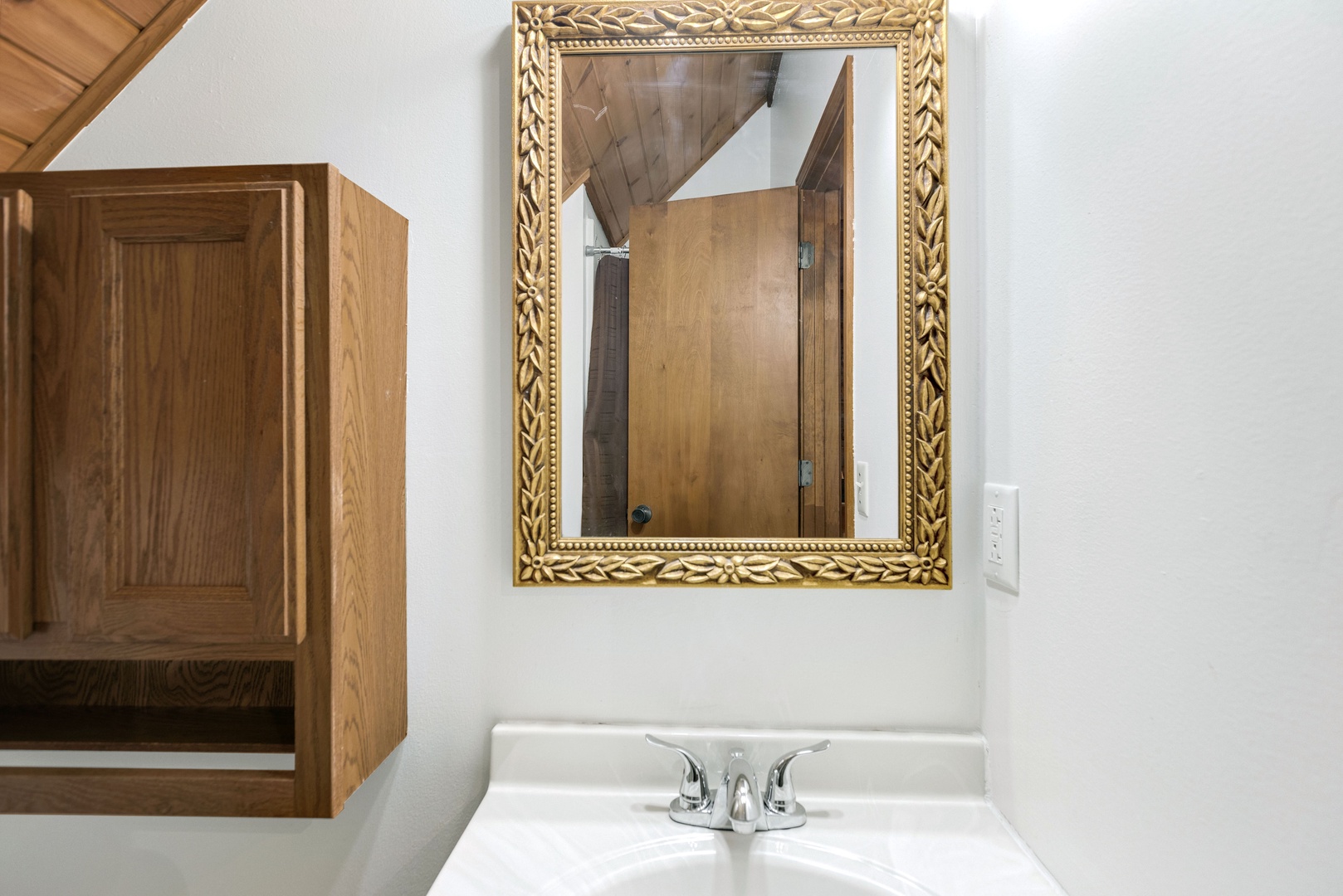 A single vanity & walk-in shower await in the loft’s full bathroom