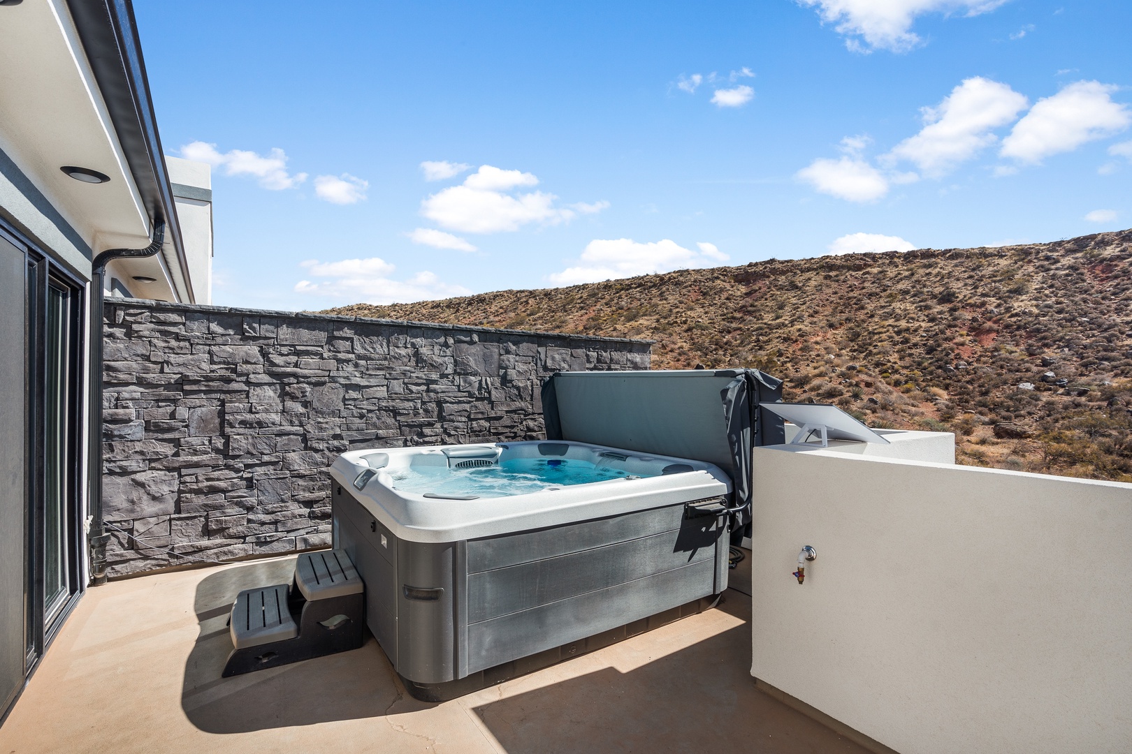 Unwind and relax in the soothing warmth of the hot tub