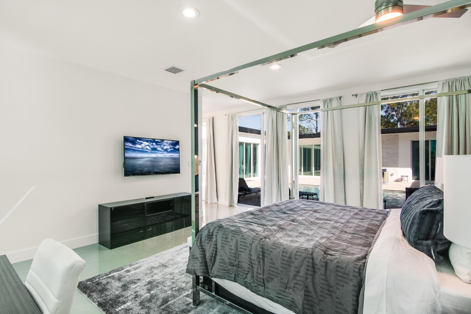 Master suite with King bed, TV, and private en-suite