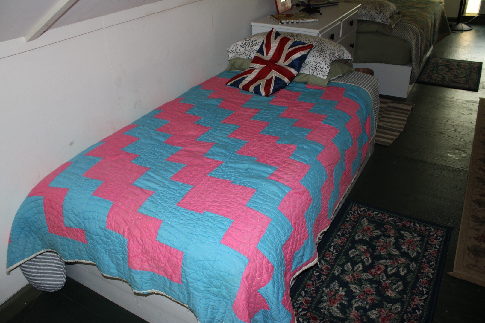 The serene loft bedroom includes three beds (one full & two twins)