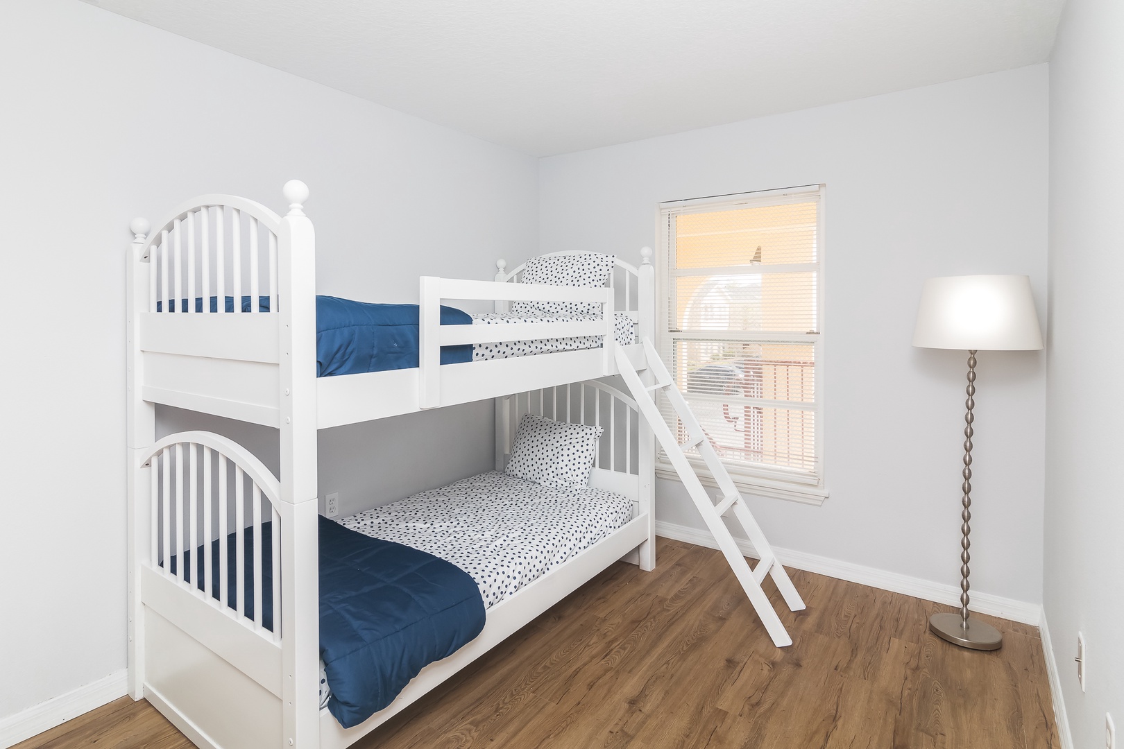 Take a snooze in this cozy twin bunk bed room