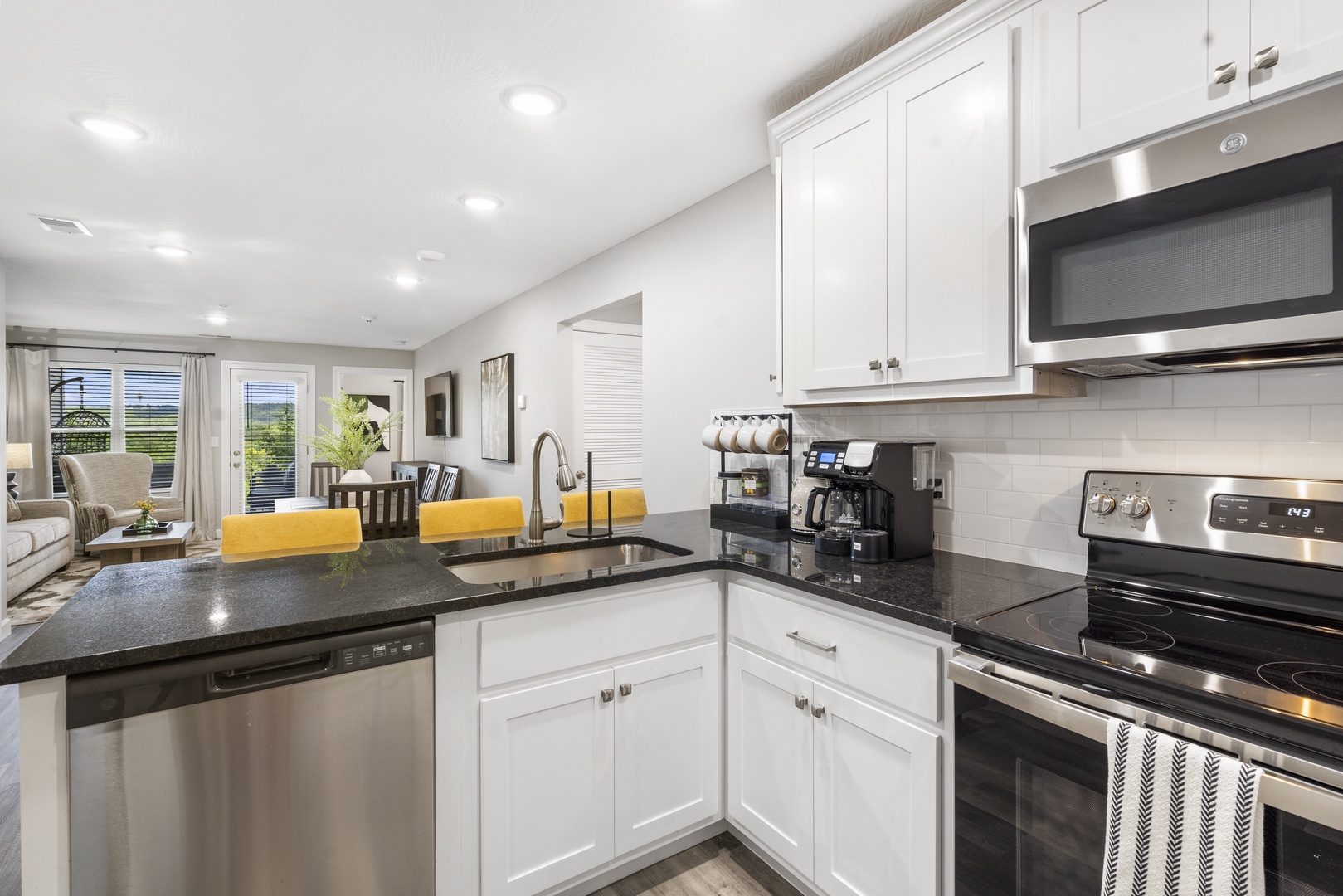 The open, airy kitchen offers ample space & all the comforts of home