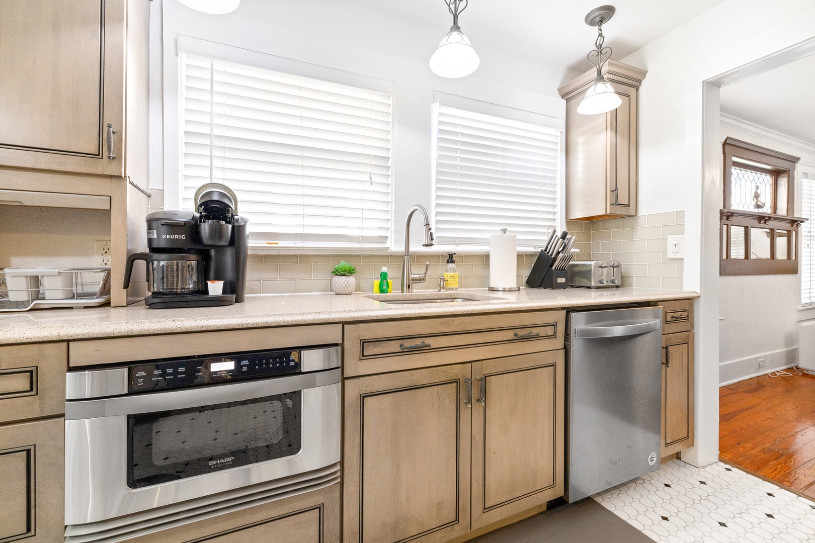 The breezy kitchen offers ample storage space & all the comforts of home