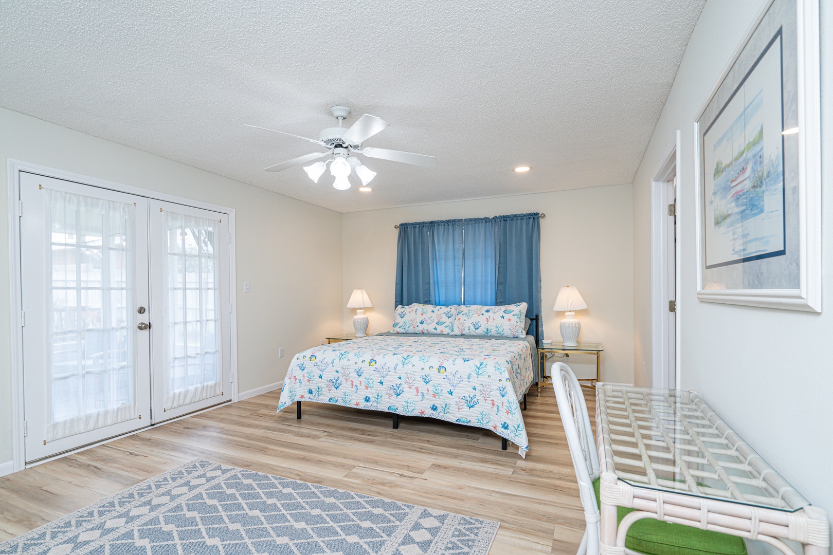 This coastal king suite boasts a private ensuite, smart TV, & patio access