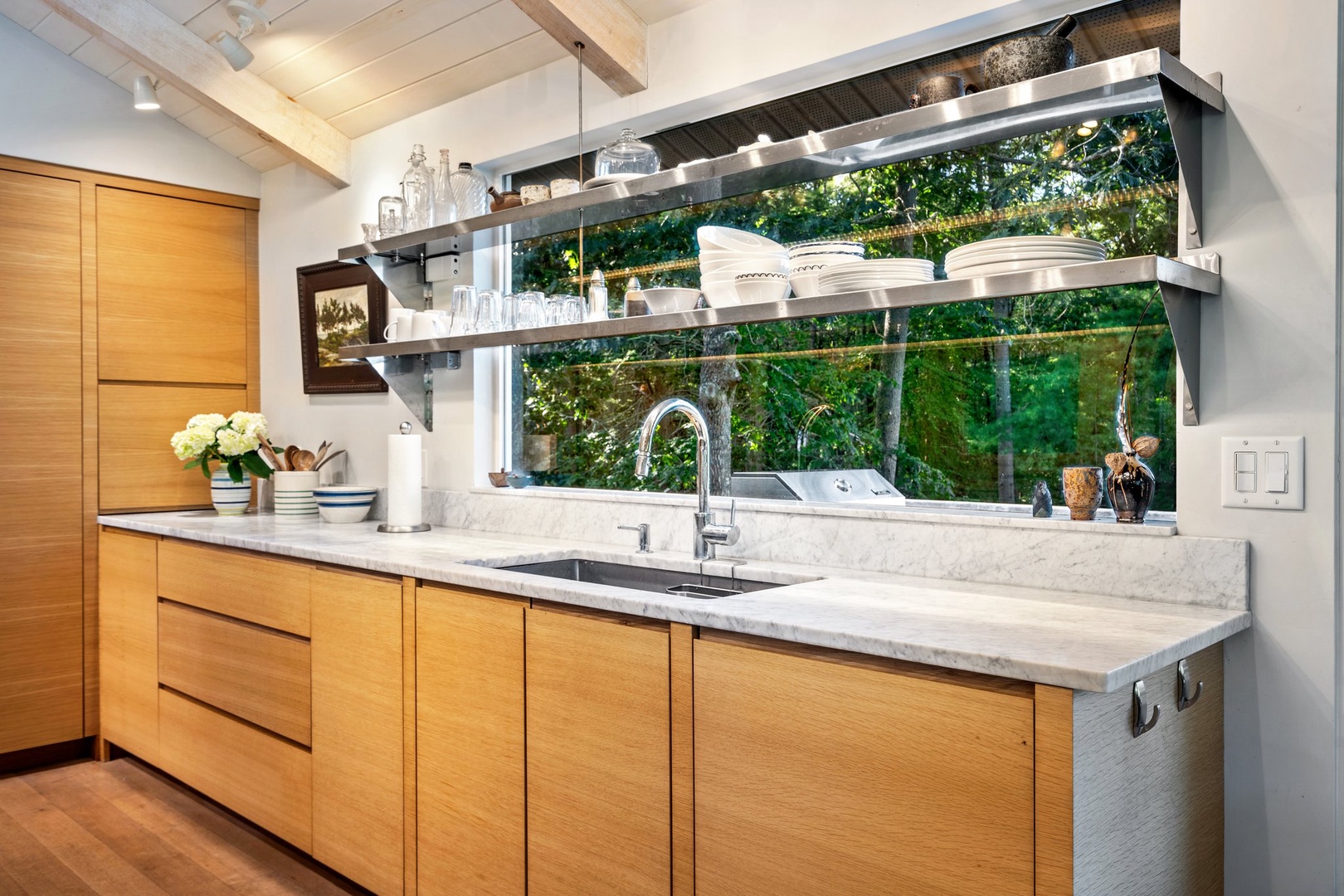 Modern elegance meets space and comfort in this inviting kitchen