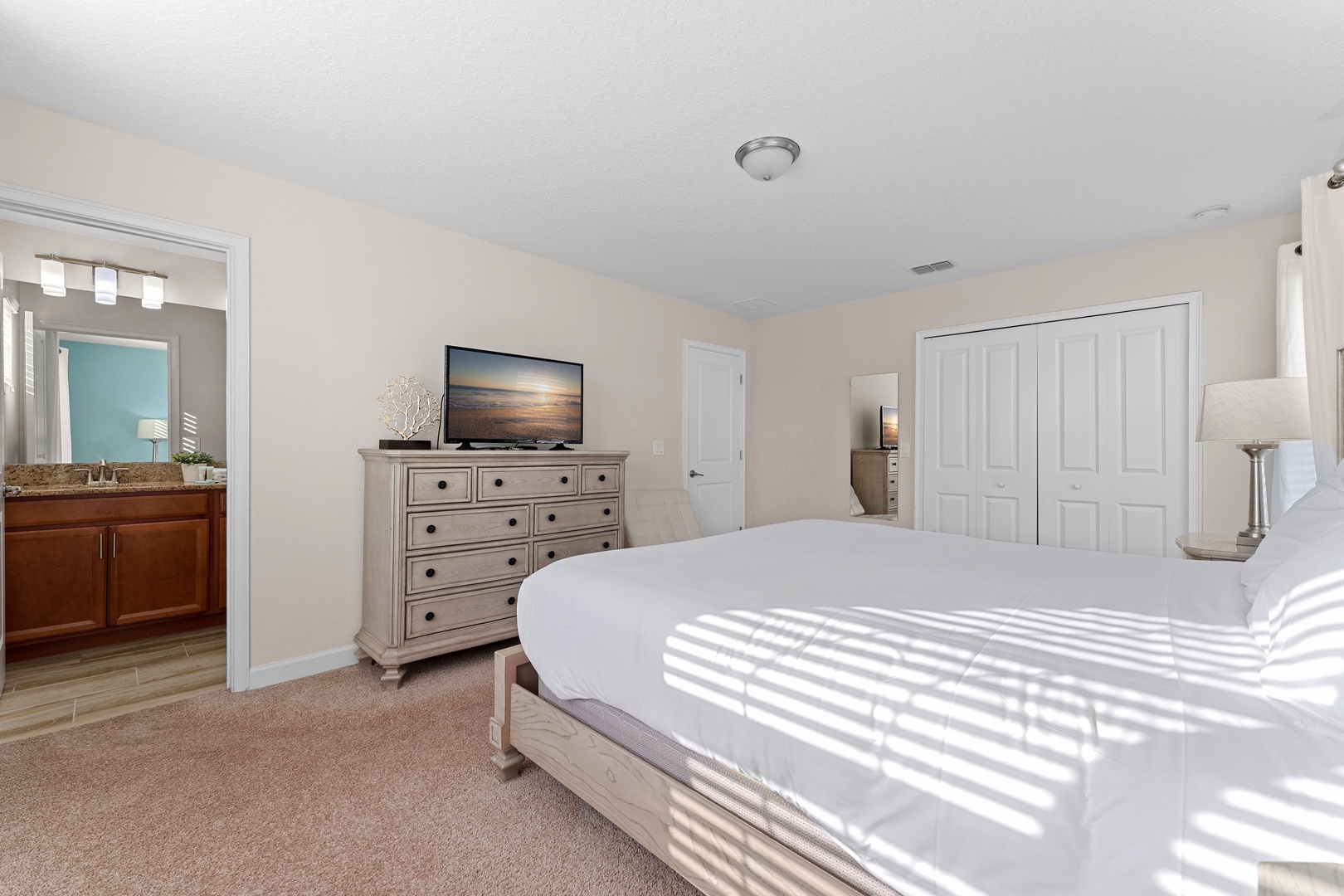 Bedroom 6 with king bed, TV, and ensuite