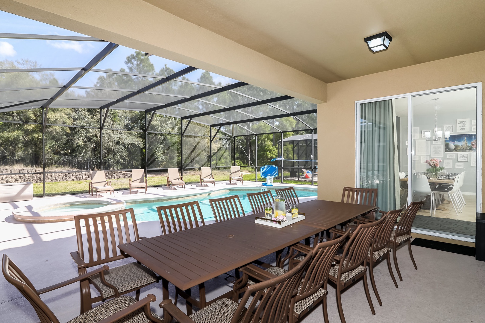 Screened pool with outdoor dining table