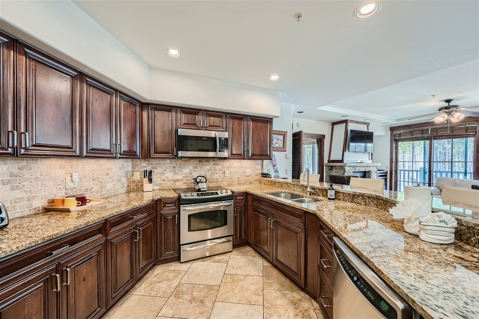 The open, elegant kitchen offers ample space & all the comforts of home