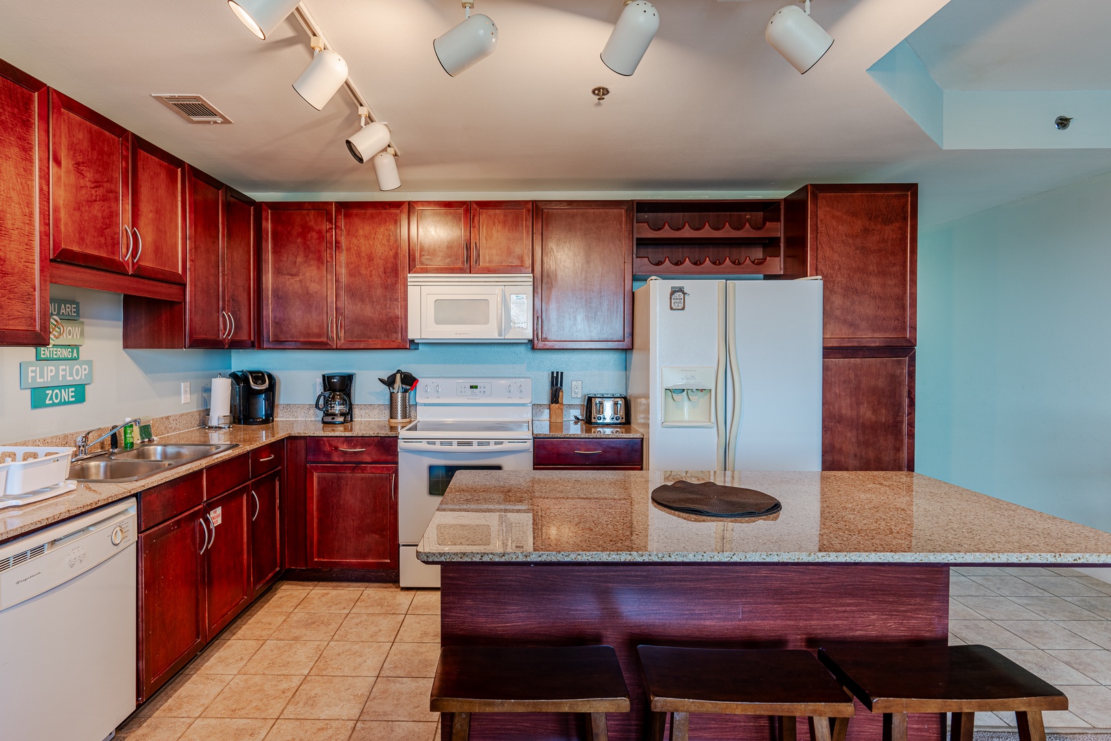 The spacious kitchen offers ample space & all the comforts of home