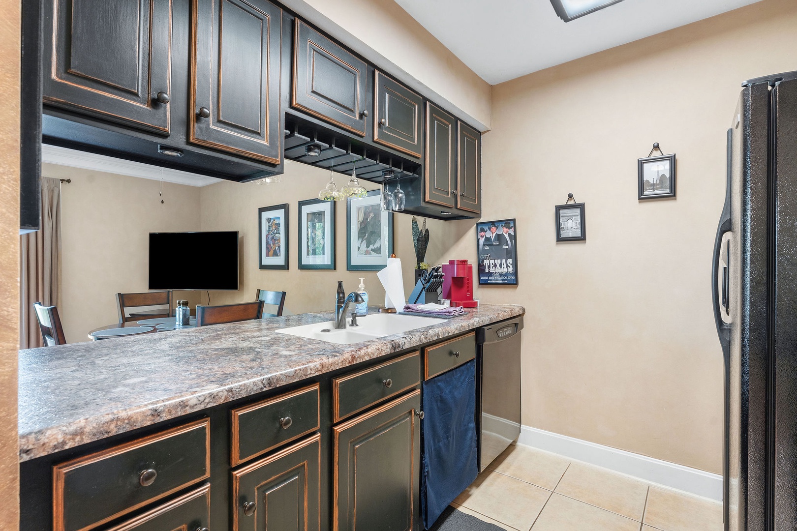 The open, airy kitchen offers ample space & every home comfort