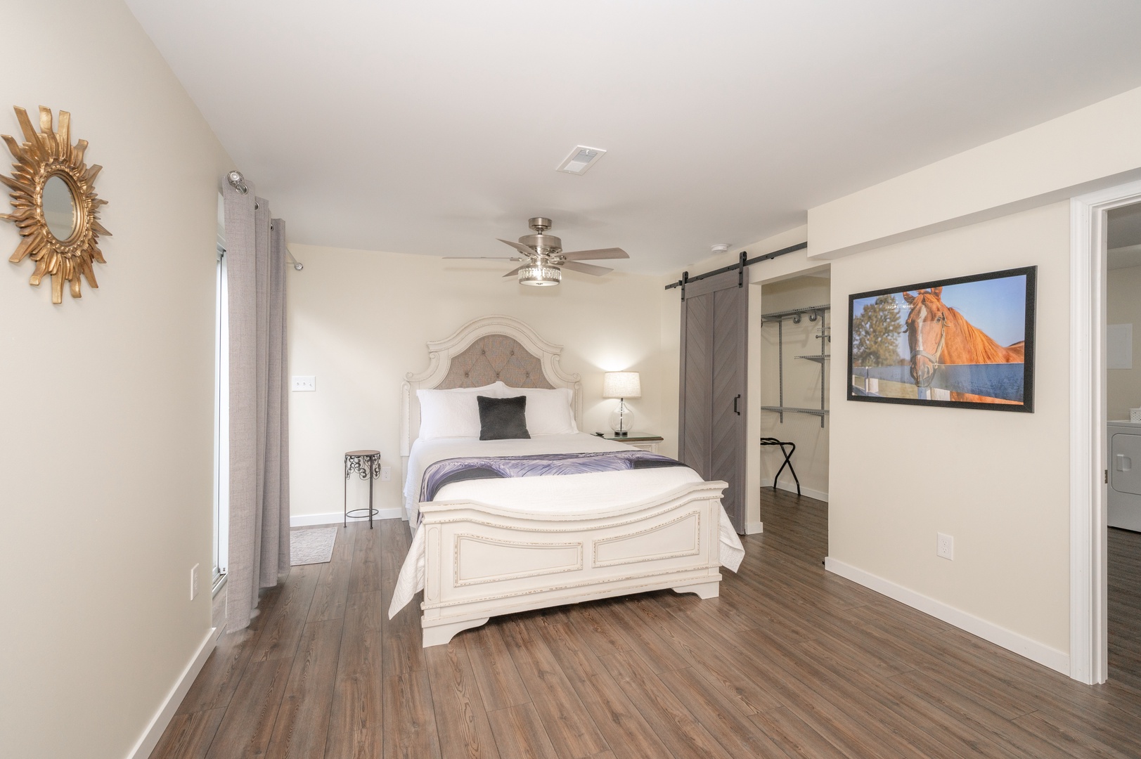 This tranquil lower-level bedroom offers a queen bed, large closet, & Smart TV