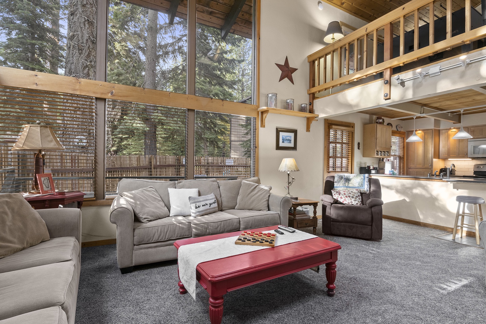 Living room with floor to ceiling windows, gas fireplace, RokuTV