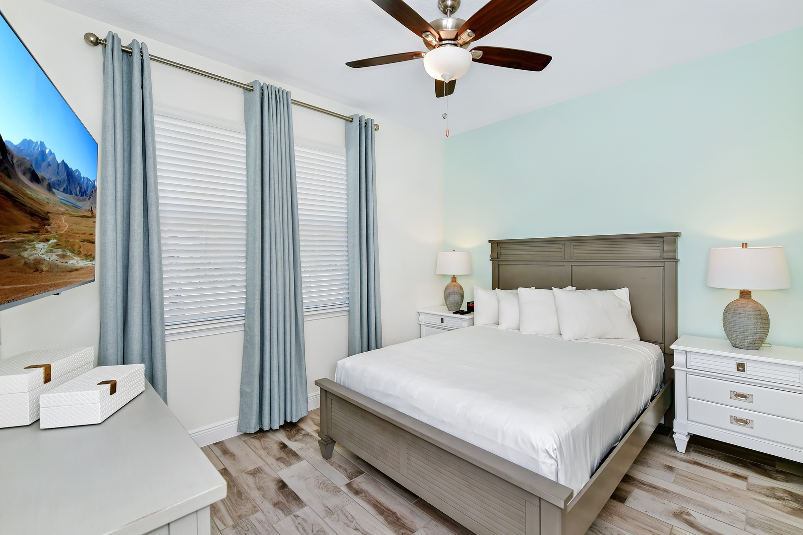 Coastal elegance awaits in this main-level queen bedroom