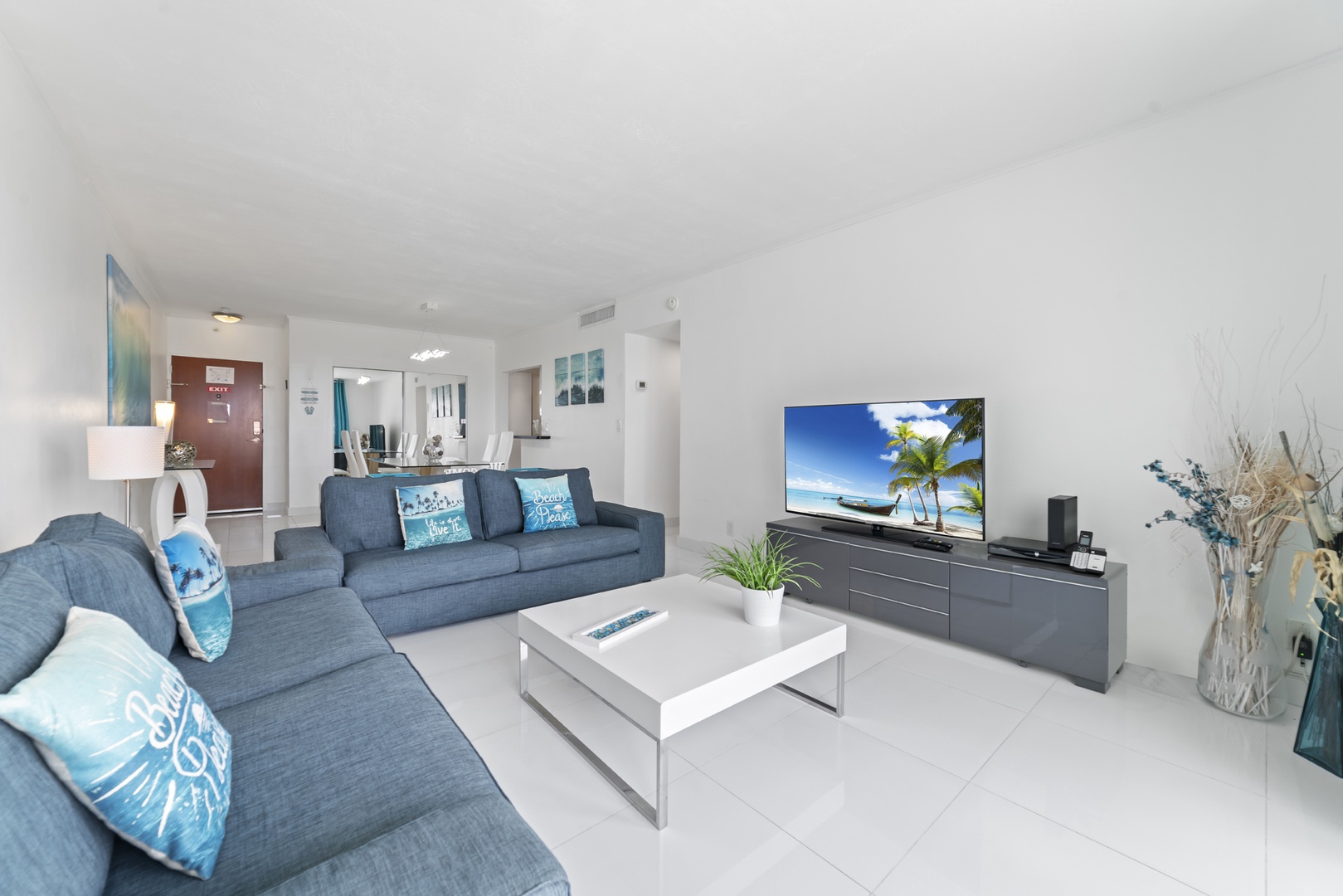Bright living space with ample seating and TV
