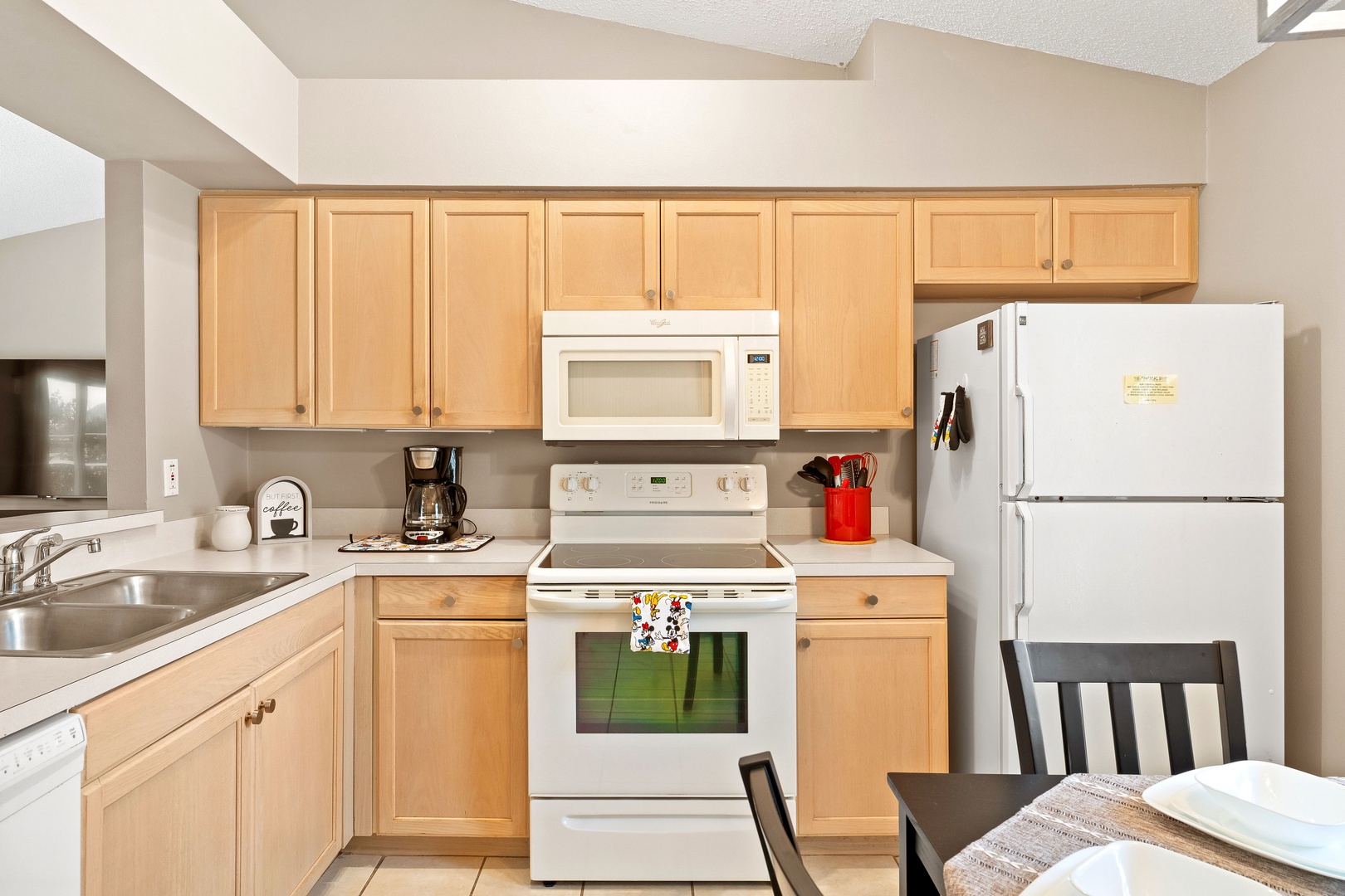 The open, airy kitchen offers ample space & all the comforts of home