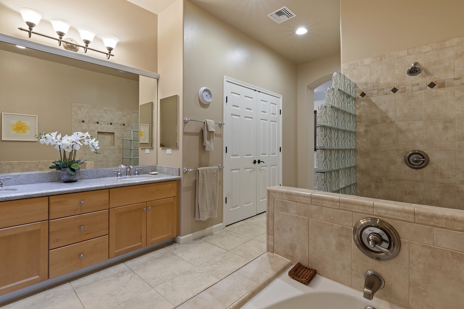 Mast bathroom includes spacious tub and standup shower