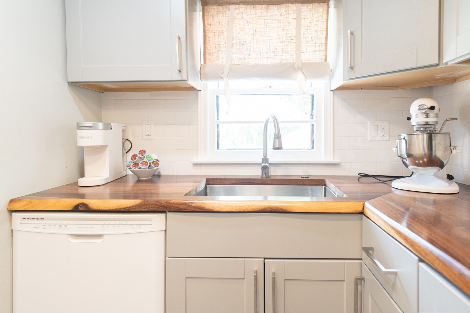 The kitchen offers ample cabinet space & all the comforts of home