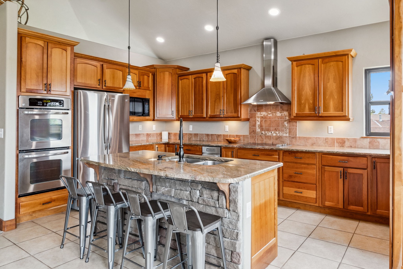 The open, airy kitchen offers ample space & all the comforts of home