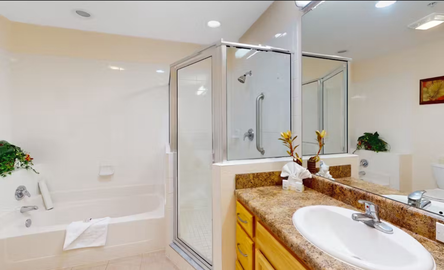 Spacious Jack & Jill bath with double vanity, walk-in shower, and tub