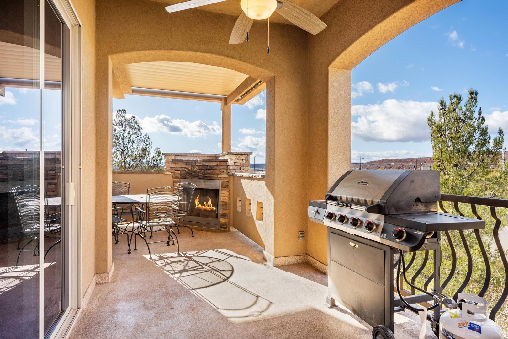 Balcony with outdoor dining and gas BBQ grill