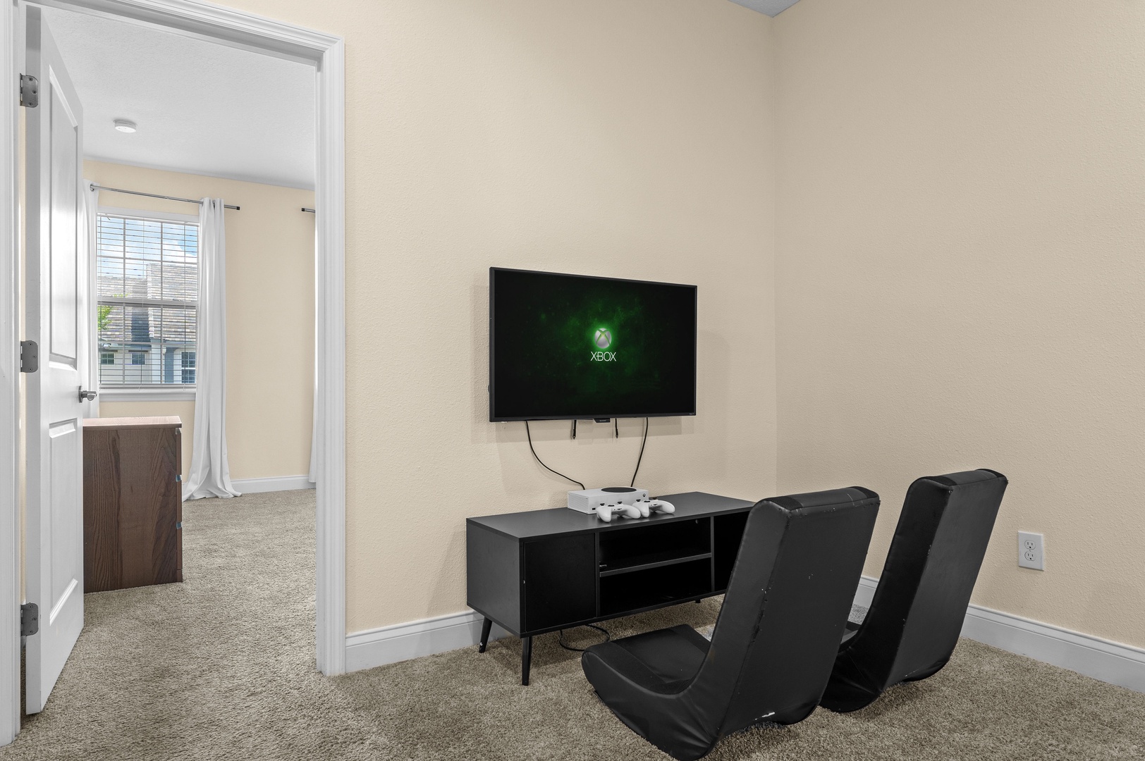 Second floor living area with Xbox and gaming chairs