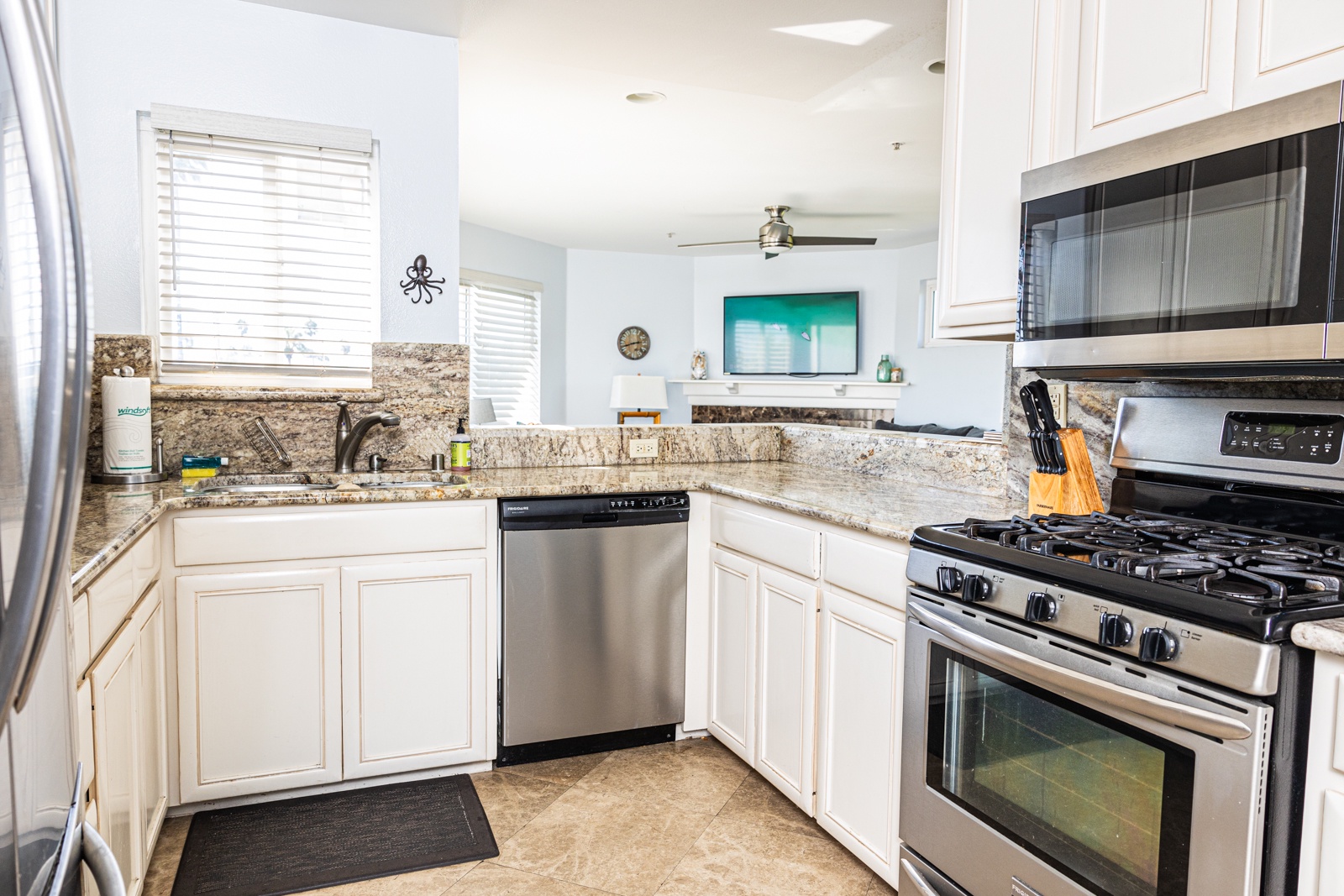 The open, airy kitchen offers ample space & every home comfort