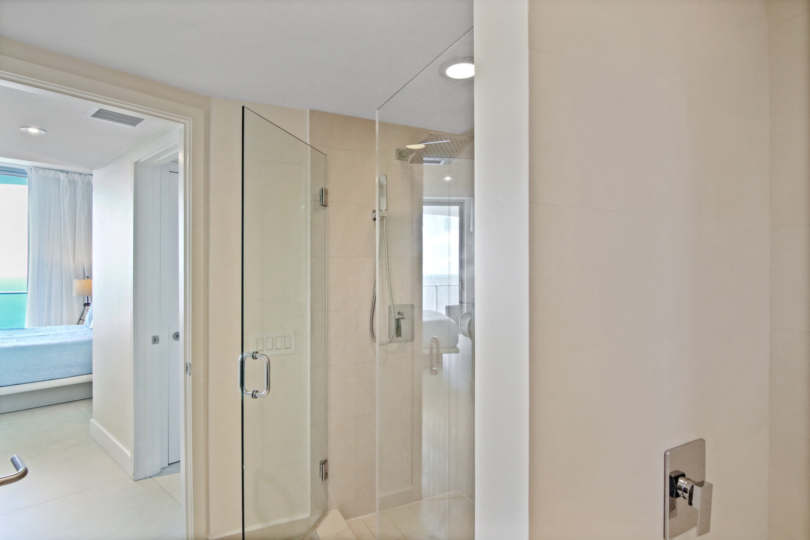The first king en suite offers a single vanity, glass shower, & soaking tub