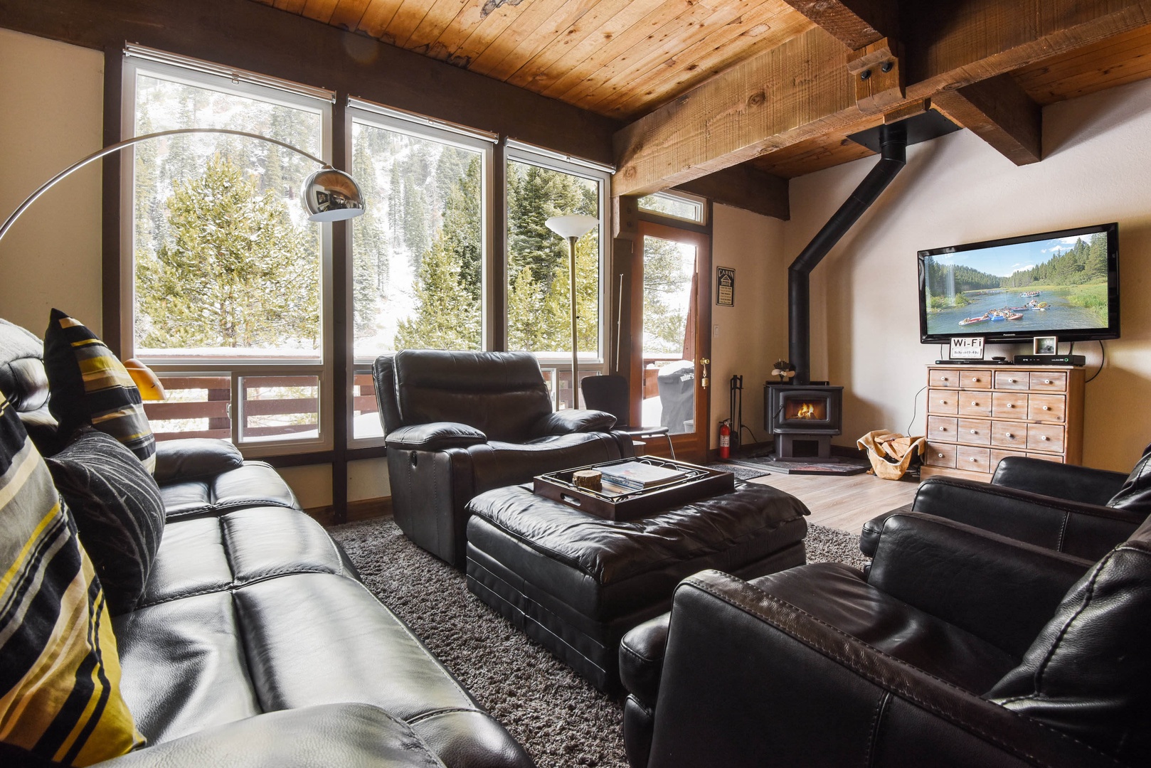 Open Living Room with flat screen tv, wood burning fireplace, comfortable seating