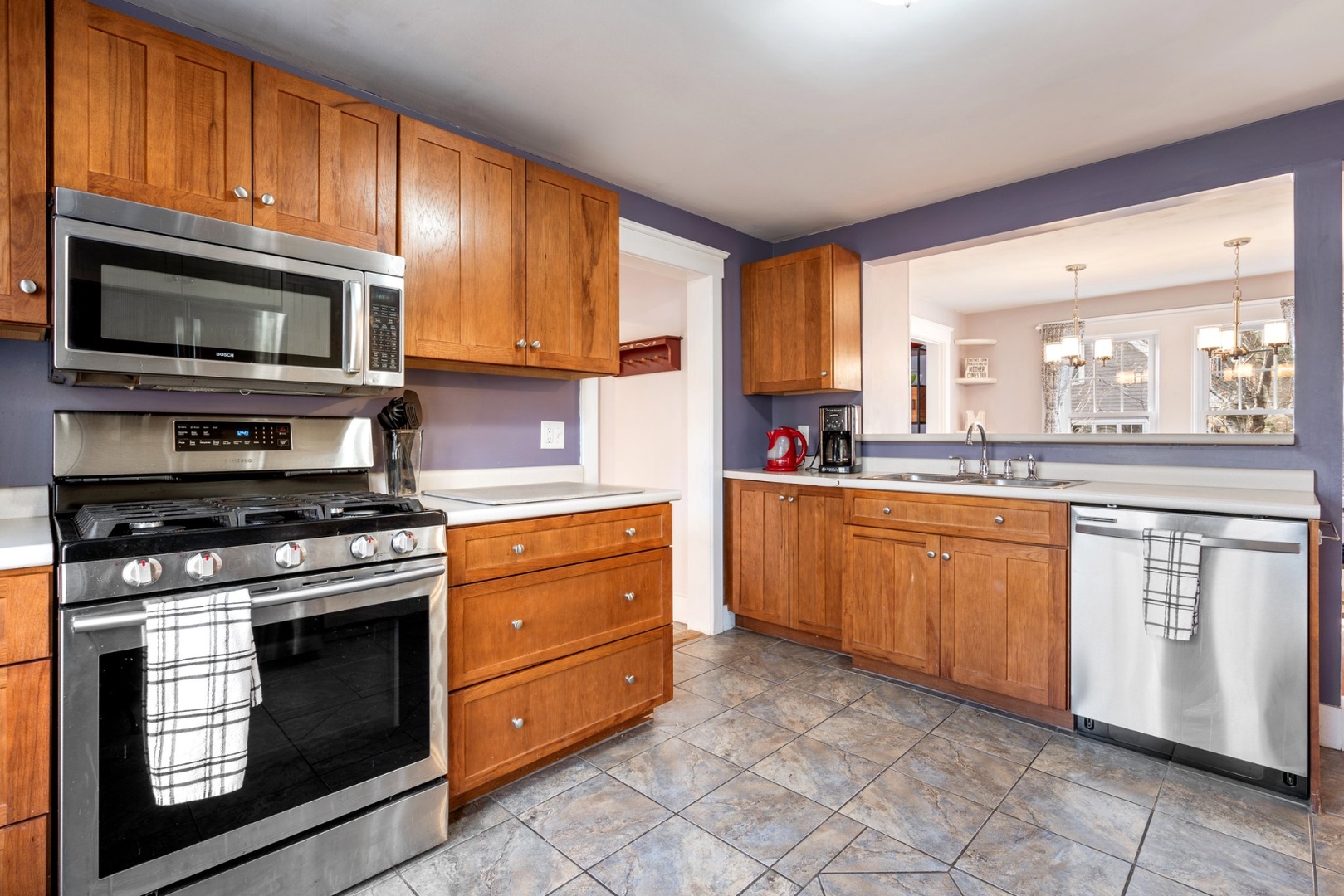 The open, airy kitchen offers ample space & all the comforts of home