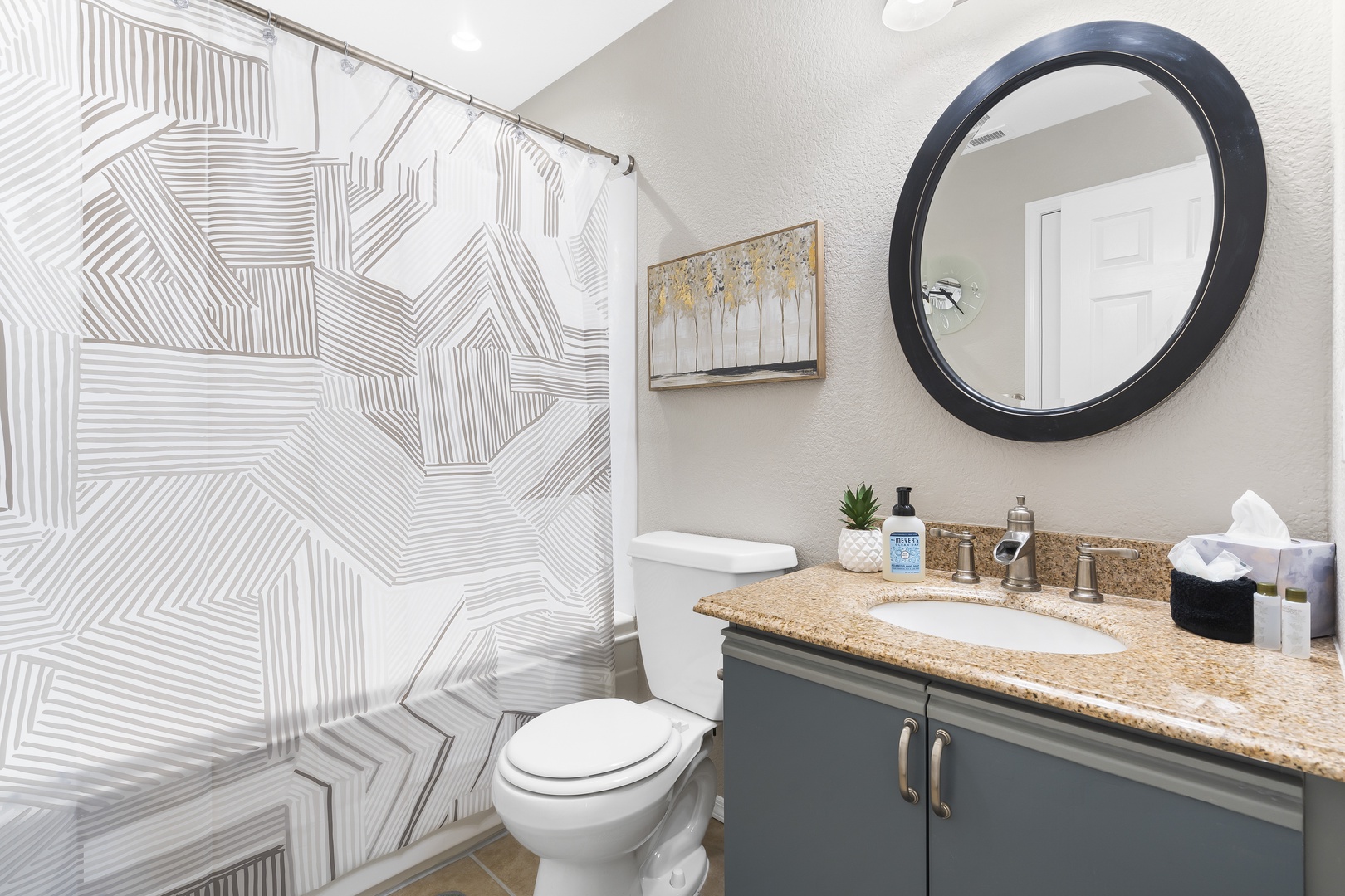 The final full bath includes a single vanity & shower/tub combo