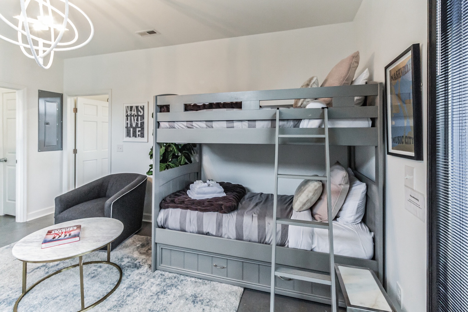 The chic first floor common area offers a twin-over-twin bunkbed
