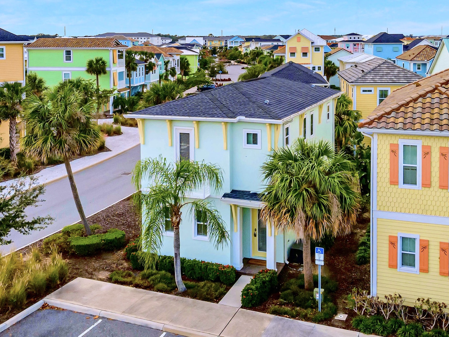 A charming seafoam green cottage on a spacious corner lot in the vibrant Margaritaville Resort
