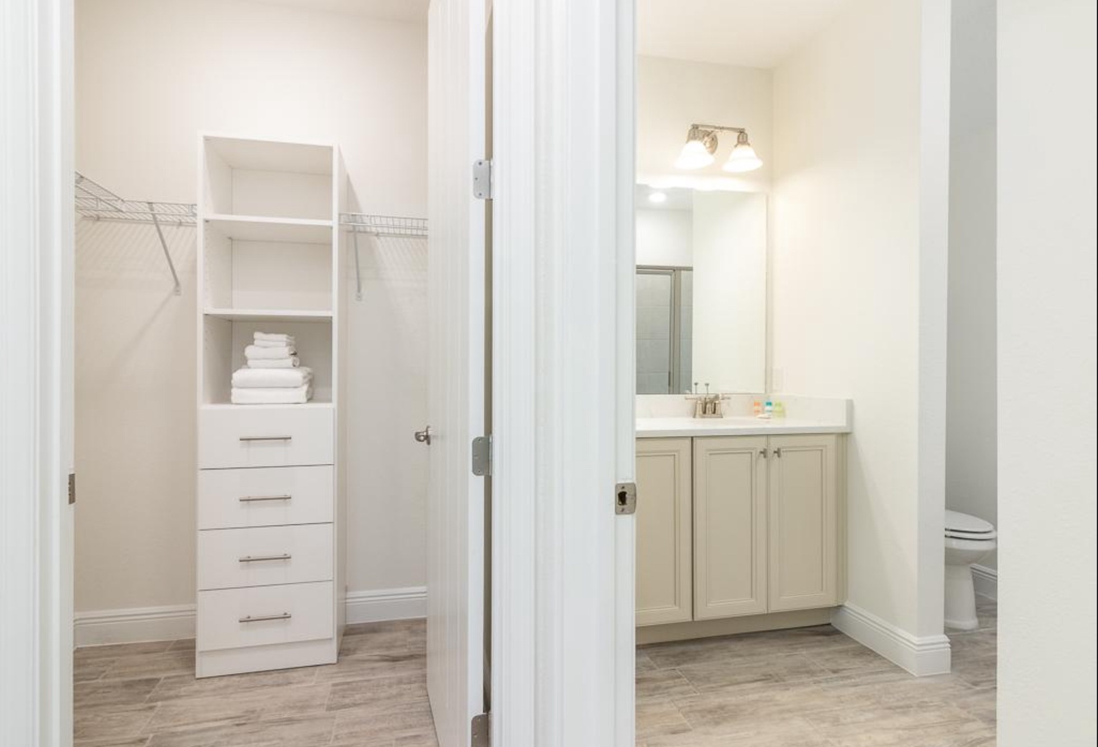 Private bathroom with dual vanity and  walk-in shower