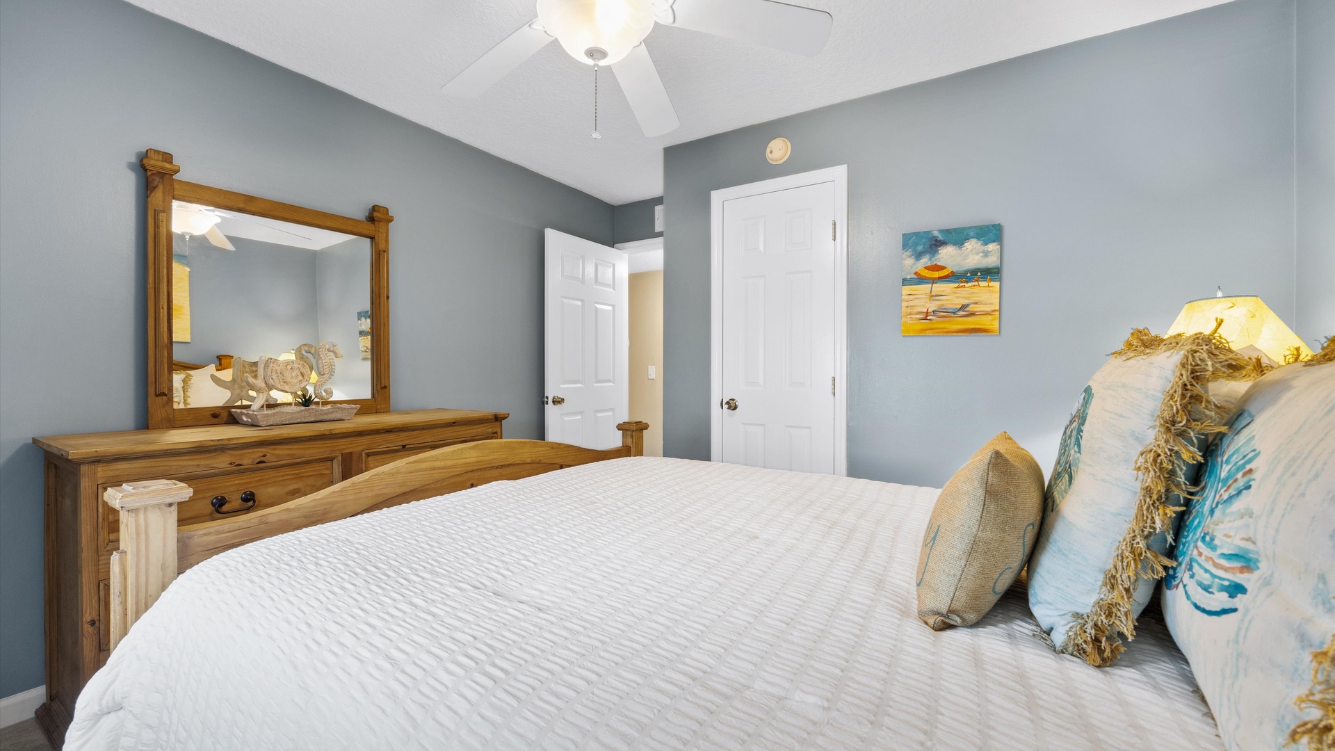 The second bedroom features a regal queen-sized bed