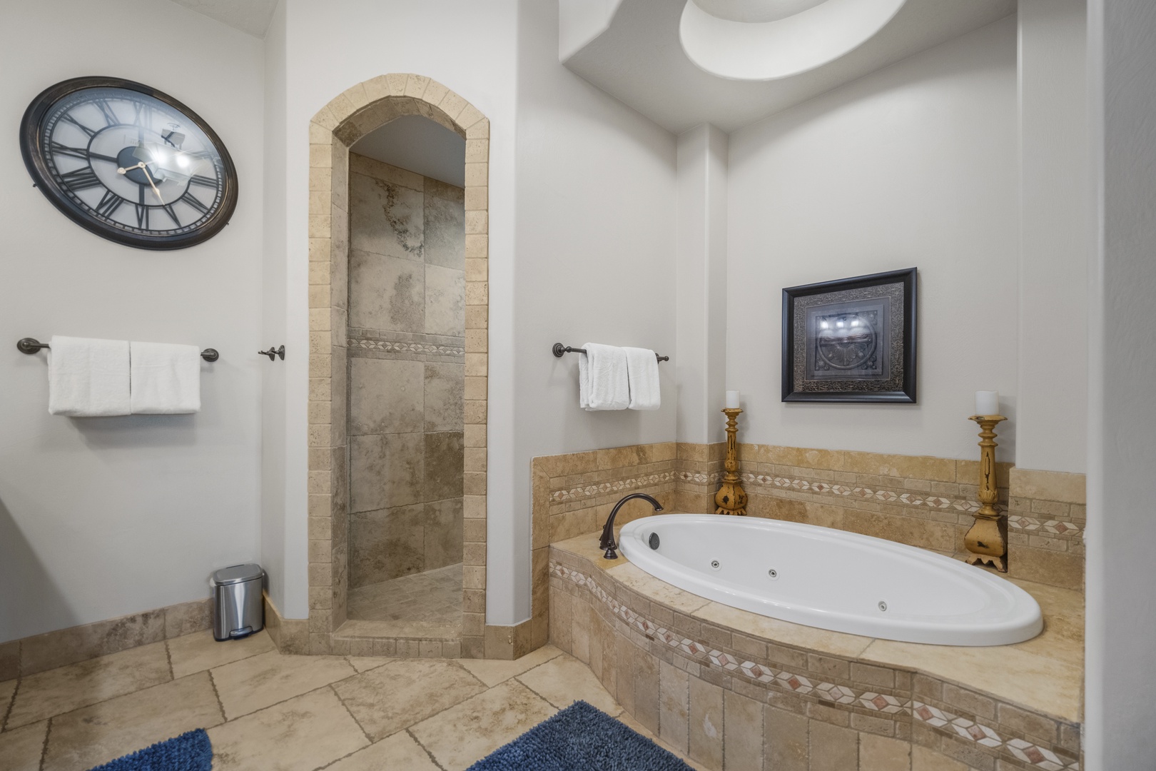 The ensuite features a double vanity, shower, & luxurious soaking tub