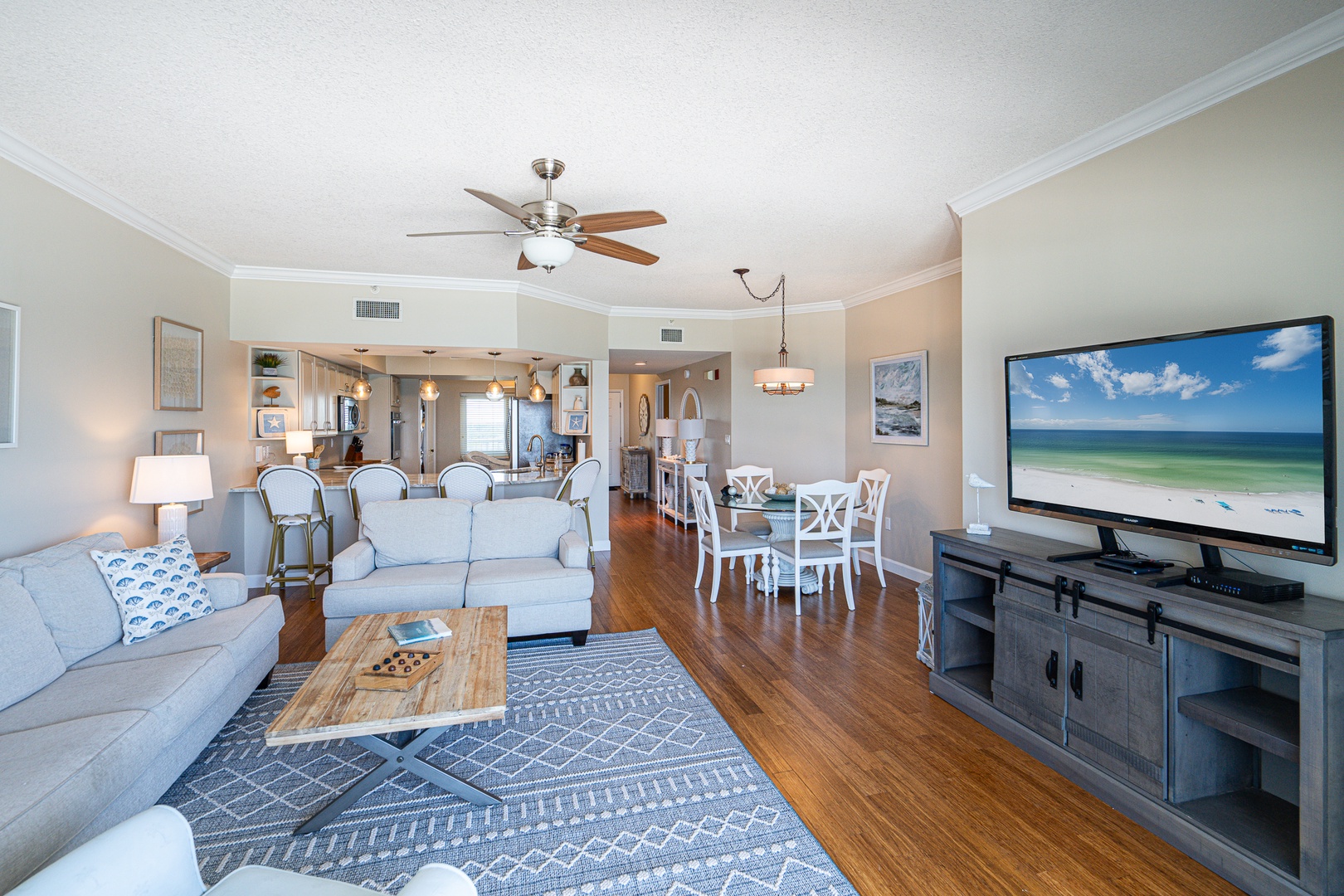 Curl up in the coastal living room & enjoy the view or a movie night at home