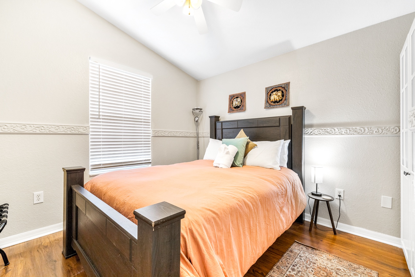 The 1st of 3 serene bedrooms, boasting a plush queen-sized bed