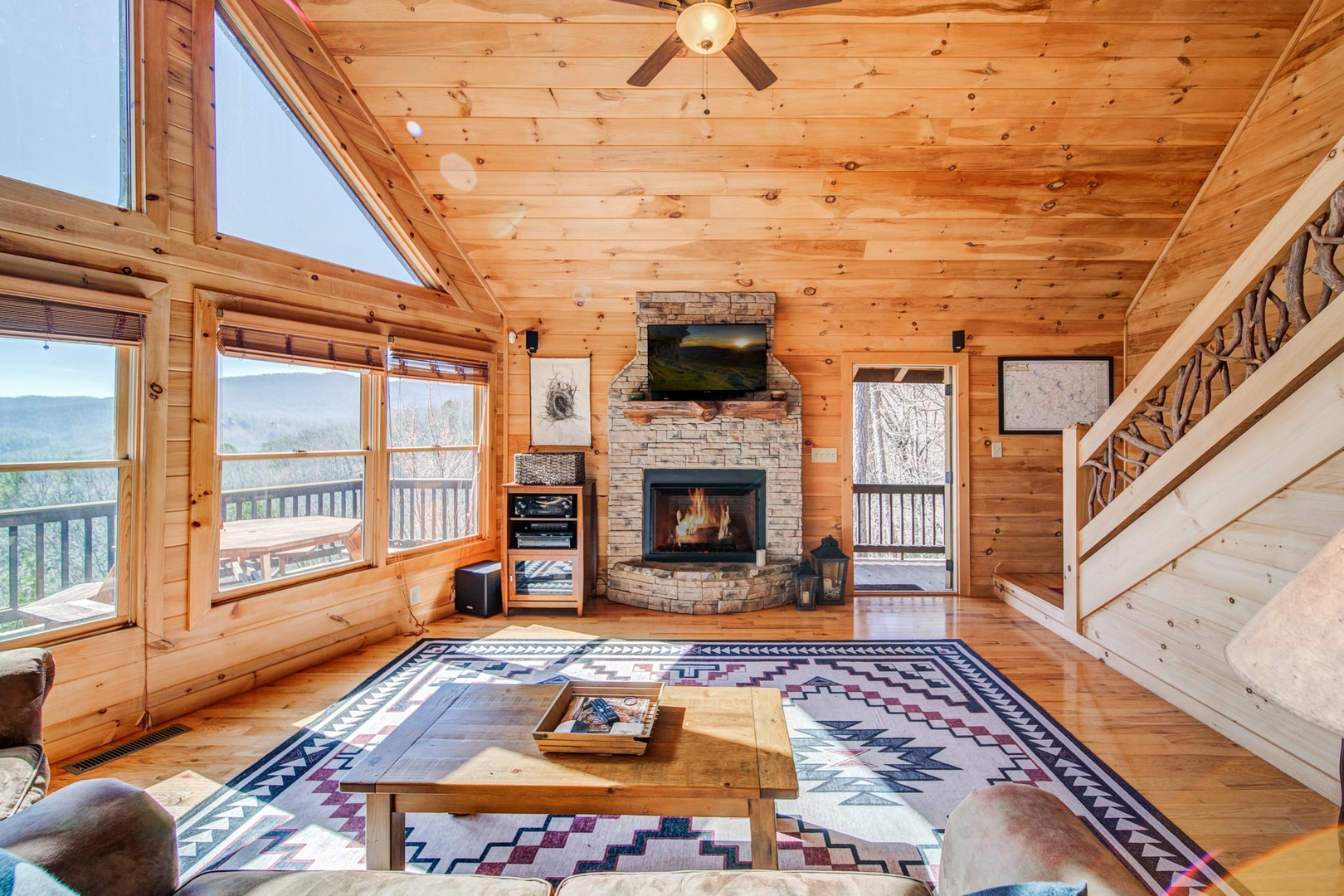 Open Chalet Main Living area with Stairs to the Loft MB and outside is a large picnic table
