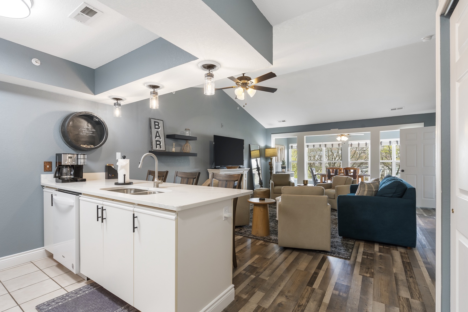 The open, breezy kitchen offers ample space & every home comfort