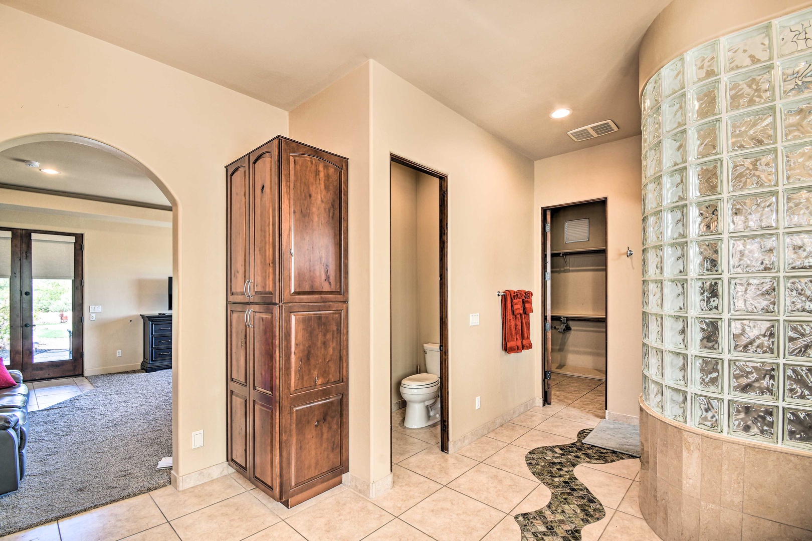 The primary ensuite offers dual vanities & separated snail shower/soaking tub