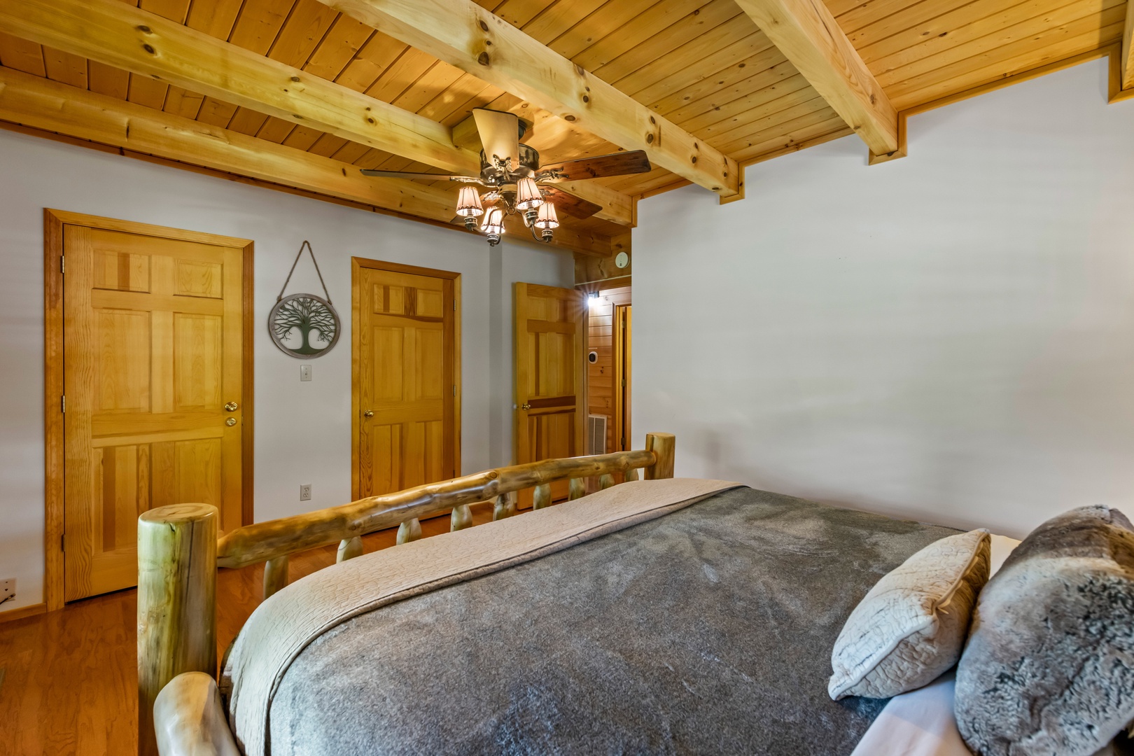 The 2nd main-floor bedroom retreat offers a plush king bed