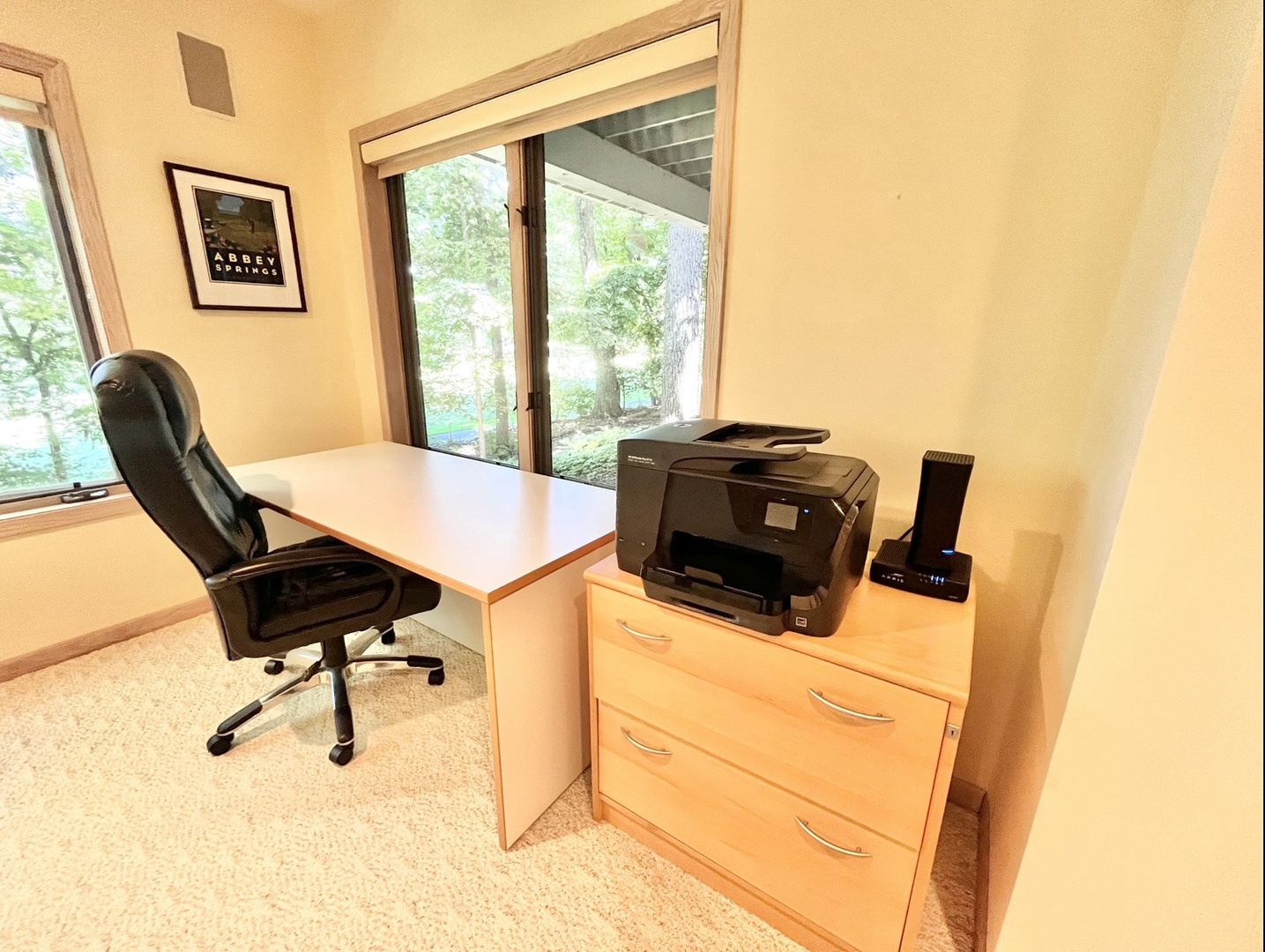 The walk-out lower-level desk workspace is an ideal spot for catching up on some work
