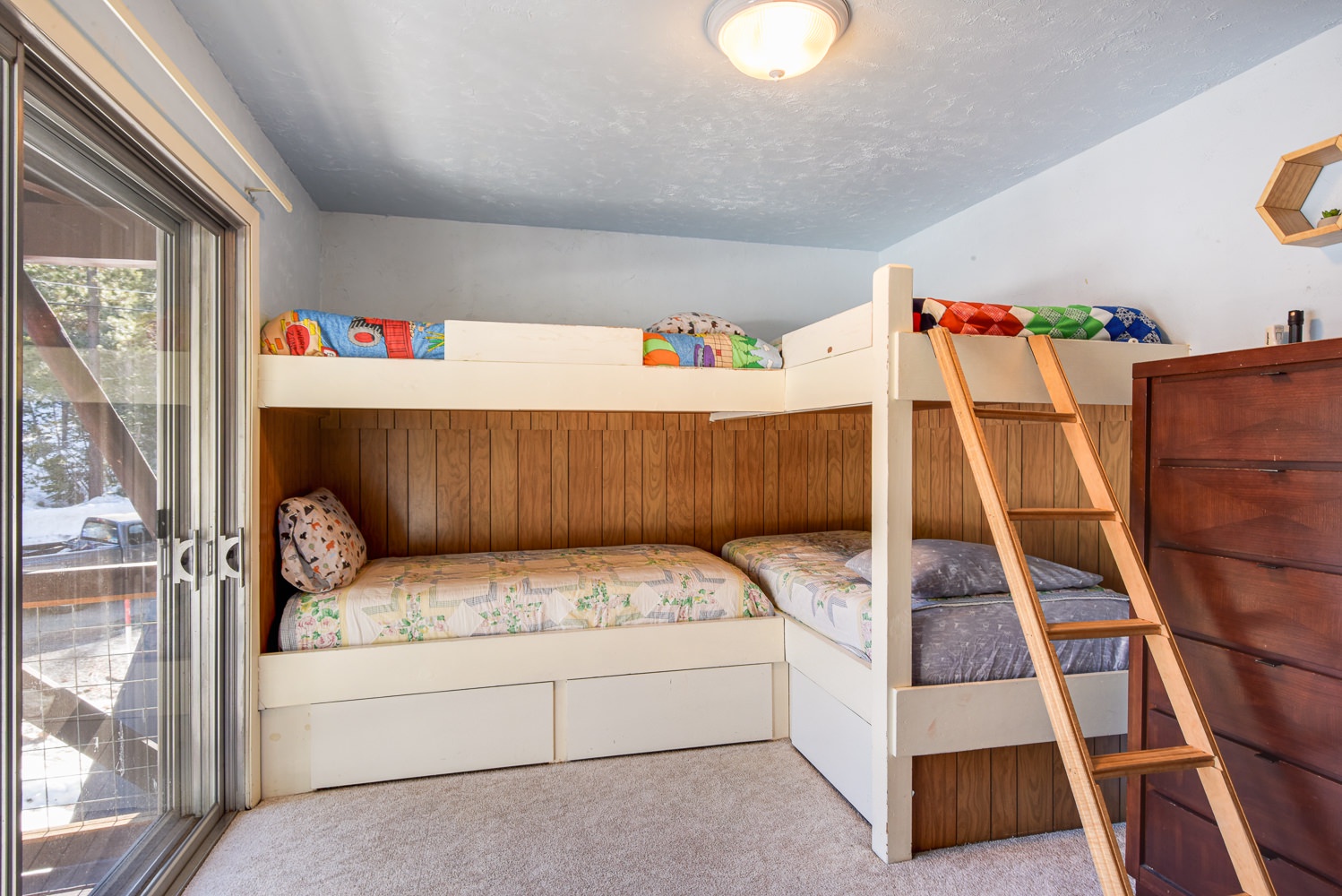 Bedroom 1 with 2 Twin/Twin bunk beds, TV, and small balcony (2nd floor)