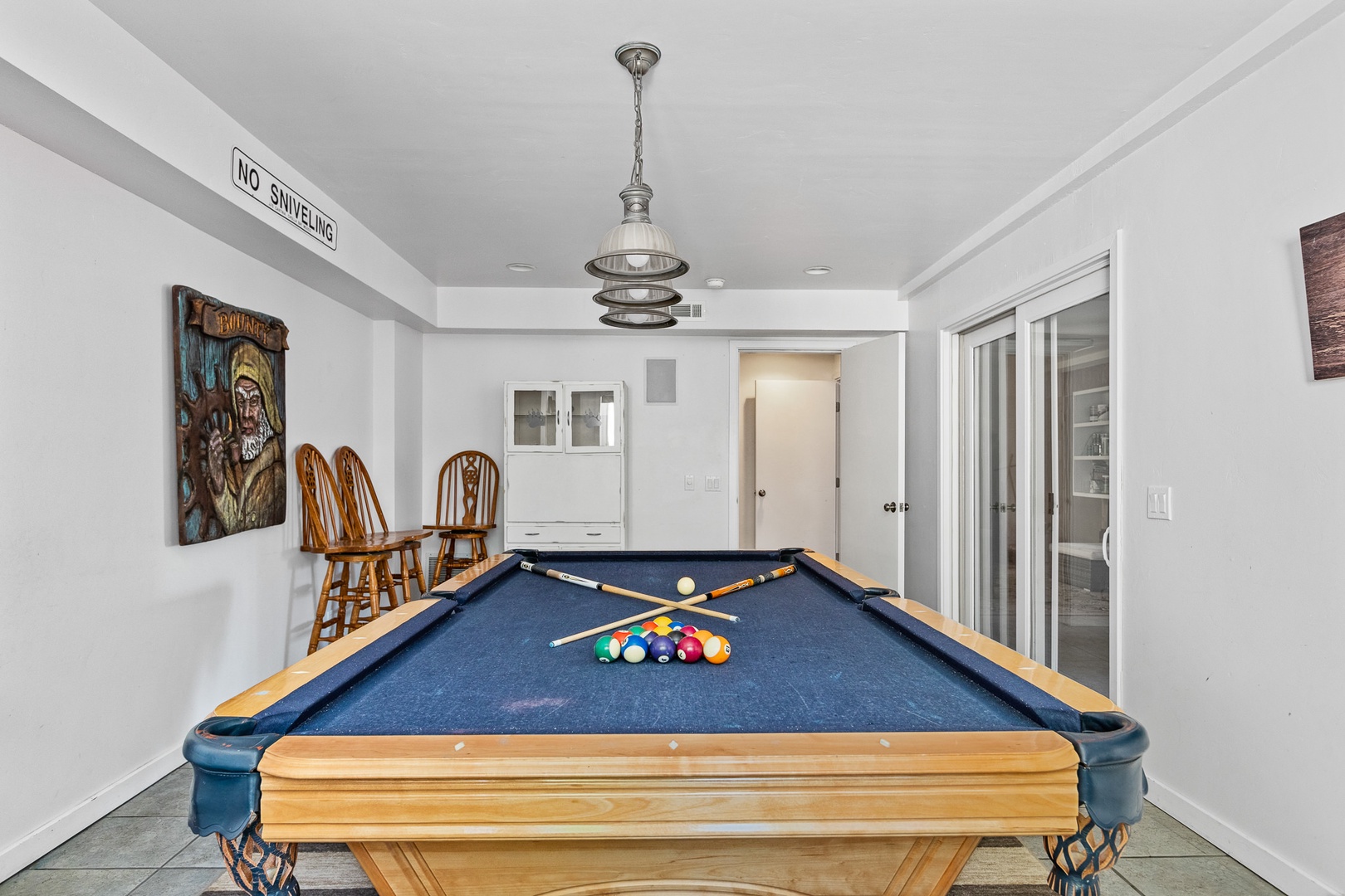 Game room is equipped with a pool table