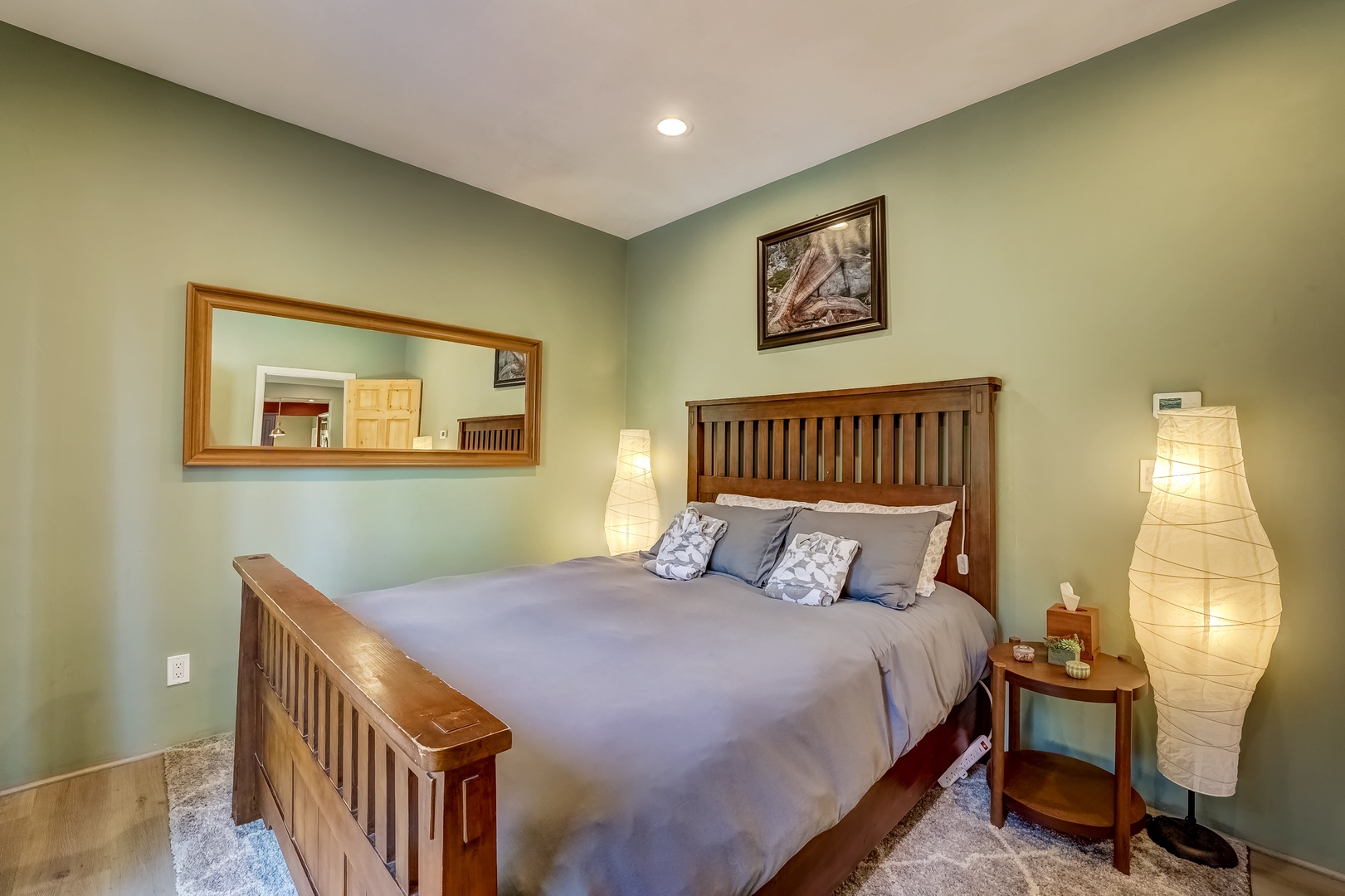Bedroom 1 off of second living room with Queen bed, and deck access(1st floor)