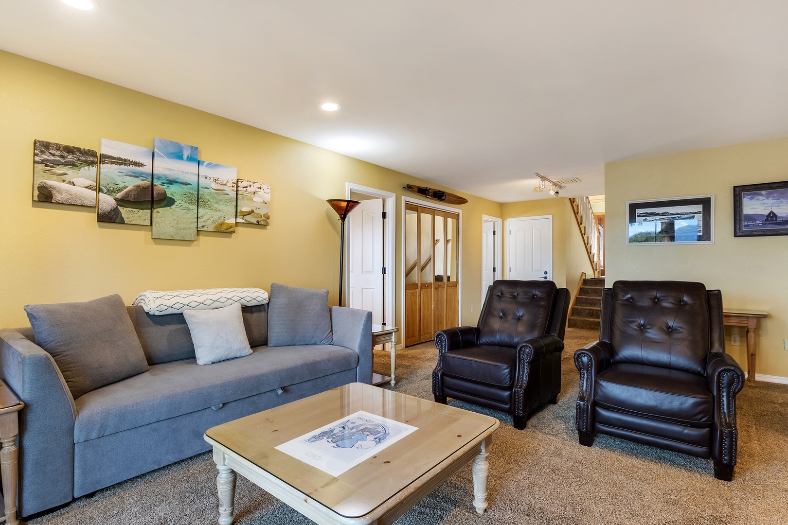 Lower living area with sofa sleeper, Smart TV, and deck