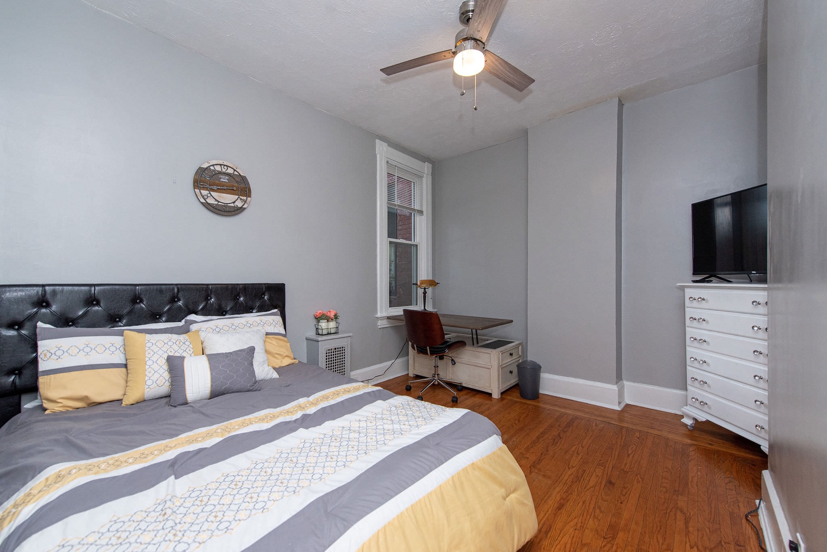 The 2nd of 3 bedrooms offers a full bed, Smart TV, & desk/workspace