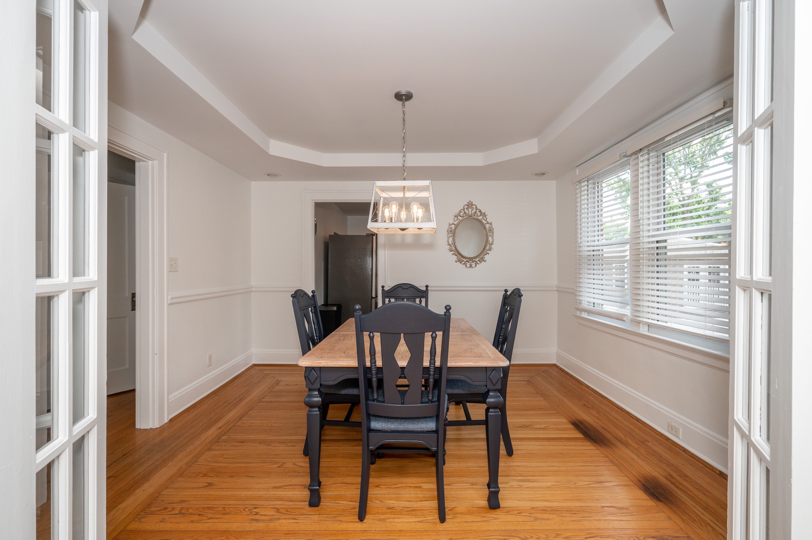 The chic formal dining room offers seating for 4