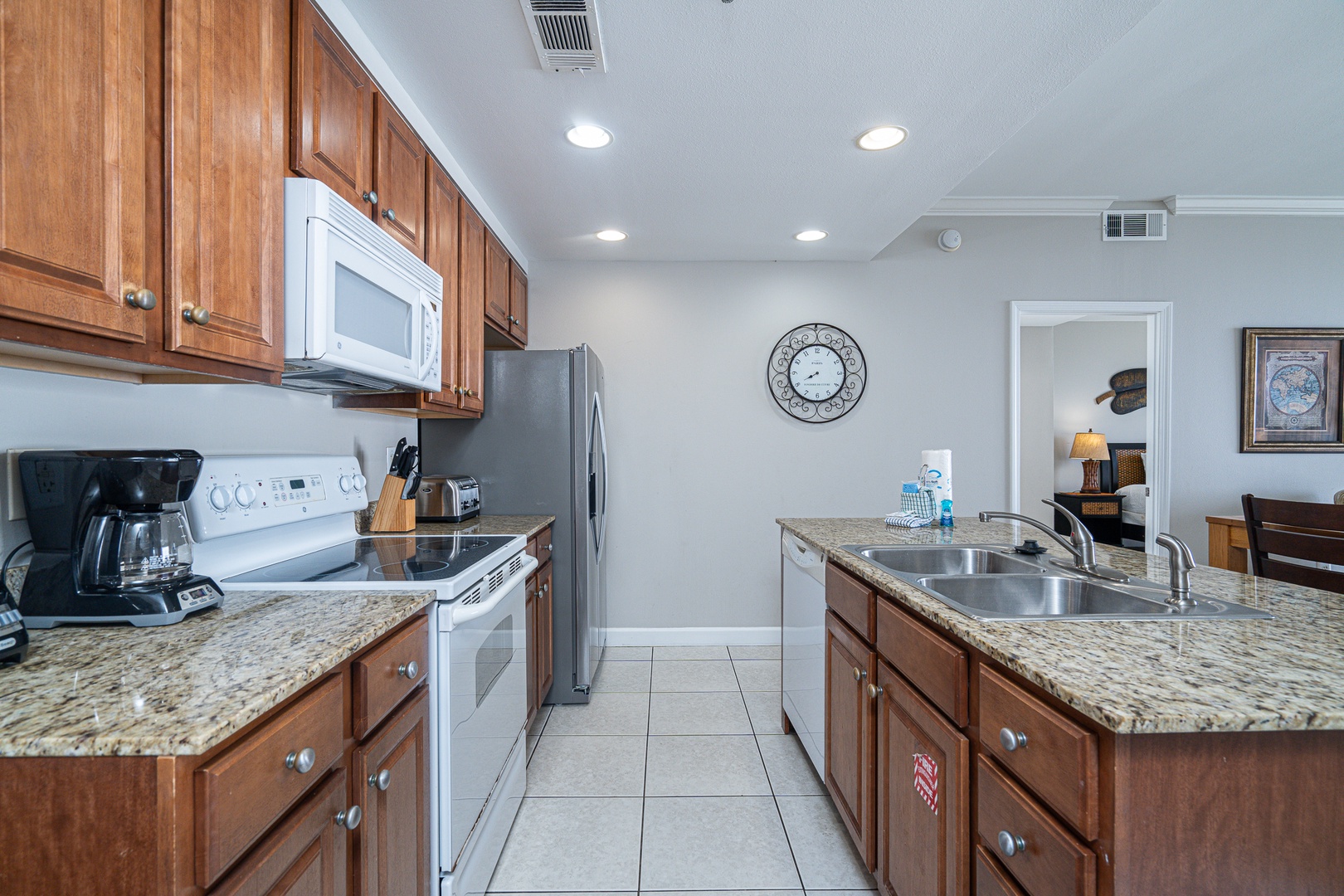 The bright, open kitchen offers ample space & all the comforts of home